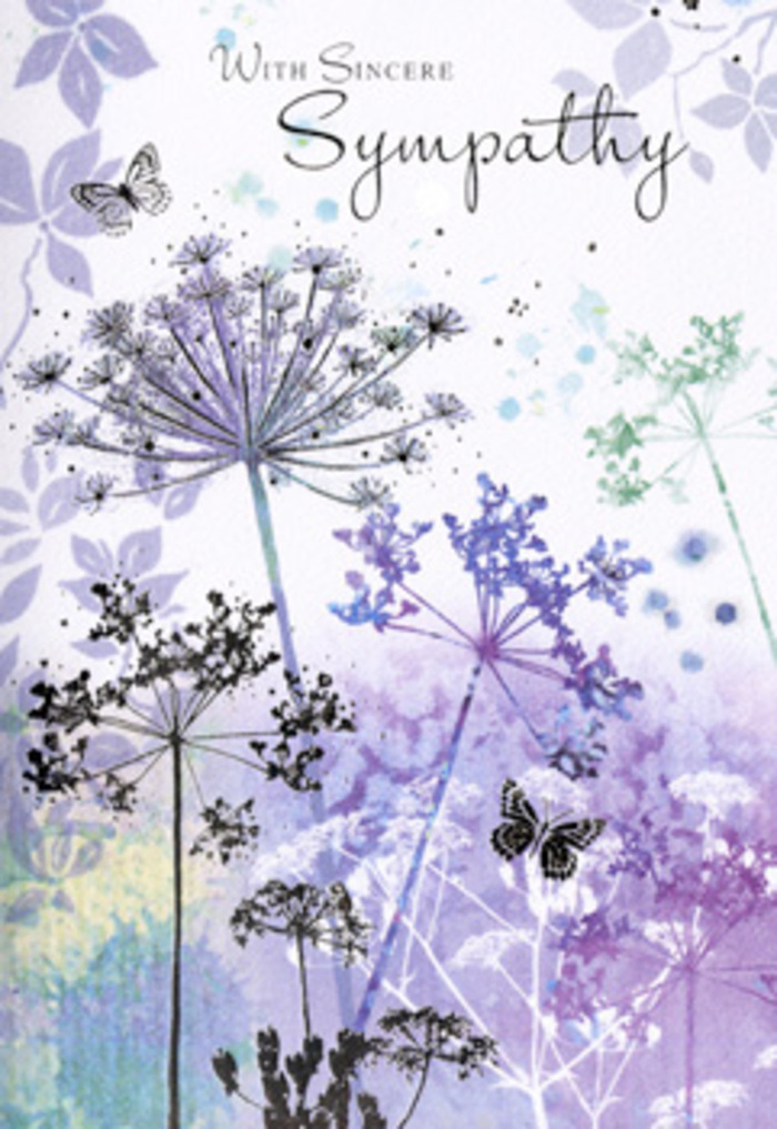The design of this sympathy card unfolds like a gentle pause in the middle of a difficult day, its composition rooted in the soft beauty of wildflowers and the calm that nature brings. Across the card, tall, slender stems rise in loose clusters, each bearing delicate umbelliferous blooms that spread out in filigree detail, reminiscent of Queen Anne's lace edging a path in one of the green pockets around Whetstone. The flowers are rendered in layered shades of lavender, dusky violet, and powdery blue, fading seamlessly into hints of grey-green foliage. These colours feel like twilight settling over nearby parks, when the light softens and everything becomes quieter and more reflective. The background is a gentle watercolour wash, mottled and blurred, with silvery undertones that suggest mist in the distance. This soft focus creates a cushion of space around the blooms, allowing them to float almost weightlessly on the page. Two pale butterflies hover among the petals, their wings softly tinted and partially transparent, embodying a sense of continuity, transformation, and the lingering presence of those we've lost. The entire illustration has a hand-drawn, hand-painted quality, the sort of detail a florist from Flowers Whetstone might notice when choosing delicate stems for a condolence arrangement. Above or alongside this tranquil scene, a simple, sincere sympathy message rests in refined script, its tone gentle rather than grand. The overall feeling is one of respectful support and quiet remembrance, like a soft-spoken companion who sits with you without needing to say very much, allowing space for emotion while offering the reassurance of thoughtful, local care.