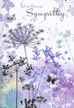 This sympathy card feels like a soft breath of air, its artwork built around airy silhouettes of wildflowers and a calm palette that soothes the eye and heart. Fine, arching stems reach upward, each one crowned with a cluster of tiny, umbrella-shaped blossoms drawn in delicate strokes, as if sketched by hand and then washed over with translucent colour. Shades of lavender, indigo, and muted cornflower blue melt into pale silver-greens and gentle greys, evoking the quiet light you might notice along a peaceful Whetstone street just after sunset. The watercolour background is diffuse and dreamlike, with no hard lines, only gentle transitions where colours blur into one another like distant foliage softened by evening mist. Fluttering among the blooms, a few butterflies appear almost like whispers of colour, their wings softly open, suggesting transformation, hope, and the comforting idea that love lingers beyond loss. Their presence adds a sense of movement, as though a mild breeze were passing through an unseen meadow. The overall composition is spacious and uncluttered, giving each flower room to breathe and mirror the kind of thoughtful simplicity found in a well-composed funeral tribute or sympathy bouquet. In elegant, flowing script, the words of condolence rest above the floral scene, unhurried and gentle, making room for personal reflection. The card's mood is tender, respectful, and understated, much like the quiet gestures families in Whetstone exchange during times of bereavement-a visual embrace that pairs beautifully with a locally arranged sympathy delivery, offering comfort without ever overwhelming the senses.